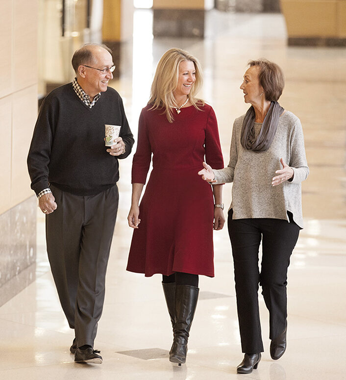 Three Plus Relocation executives walking talking - Mick, Susan, Sandy